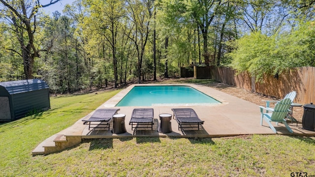 view of swimming pool featuring a lawn and a patio area