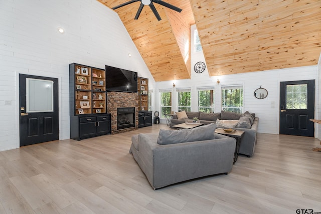 living room with a fireplace, light hardwood / wood-style flooring, high vaulted ceiling, and wooden ceiling