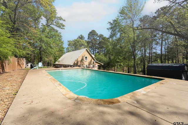 view of swimming pool with a patio area