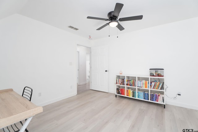 recreation room with ceiling fan, light hardwood / wood-style floors, and lofted ceiling