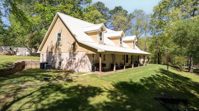 back of property with a patio and a lawn