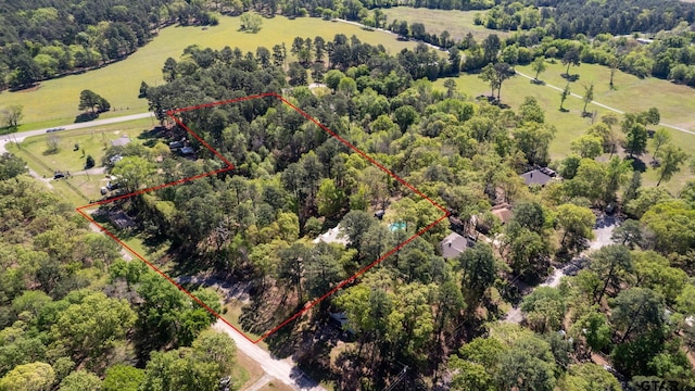 birds eye view of property featuring a rural view