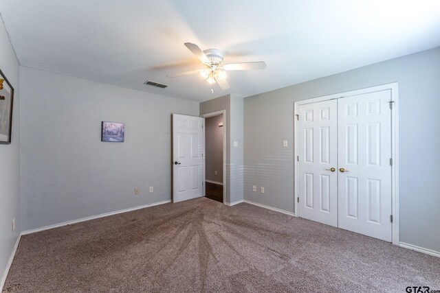 1853 Woodbridge Dr, Sulphur Springs, TX 75482 - unfurnished bedroom with carpet floors, baseboards, a closet, and ceiling fan