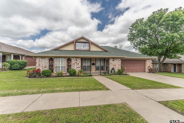1853 Woodbridge Dr, Sulphur Springs, TX 75482 - view of front of home featuring a garage, brick siding, concrete driveway, and a front yard