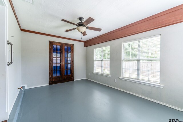 1853 Woodbridge Dr, Sulphur Springs, TX 75482 - spare room featuring french doors, finished concrete flooring, baseboards, ceiling fan, and crown molding