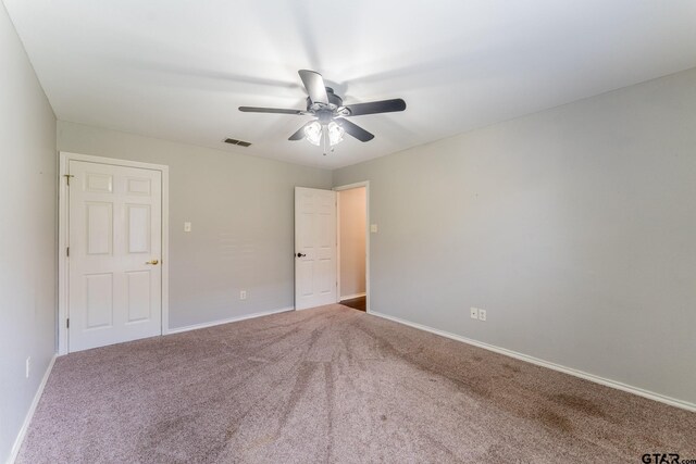 1853 Woodbridge Dr, Sulphur Springs, TX 75482 - carpeted spare room with ceiling fan and baseboards