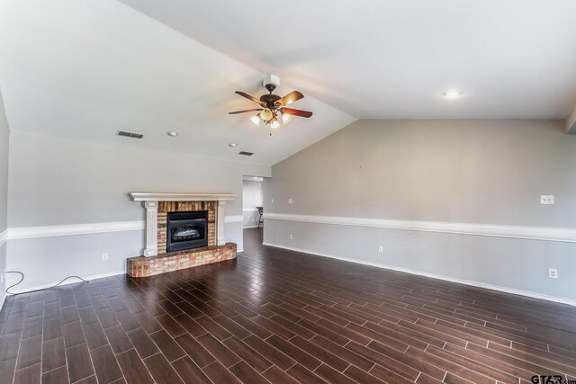 1853 Woodbridge Dr, Sulphur Springs, TX 75482 - unfurnished living room with a ceiling fan, vaulted ceiling, a brick fireplace, baseboards, and wood finished floors