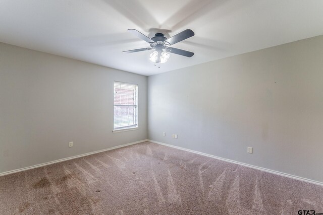 1853 Woodbridge Dr, Sulphur Springs, TX 75482 - carpeted spare room with ceiling fan and baseboards