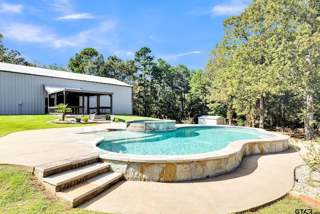 view of pool featuring a patio and a hot tub