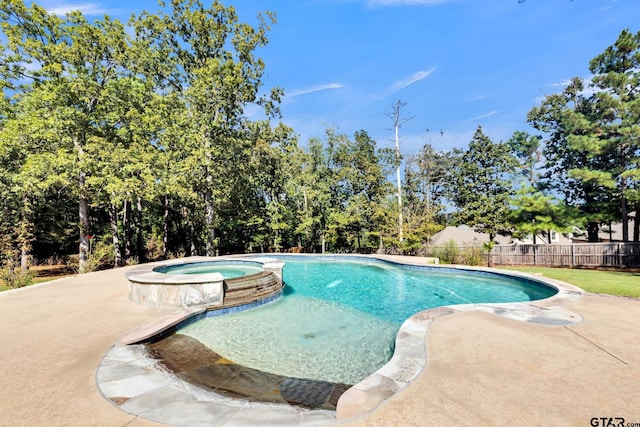 view of swimming pool featuring an in ground hot tub and a patio area