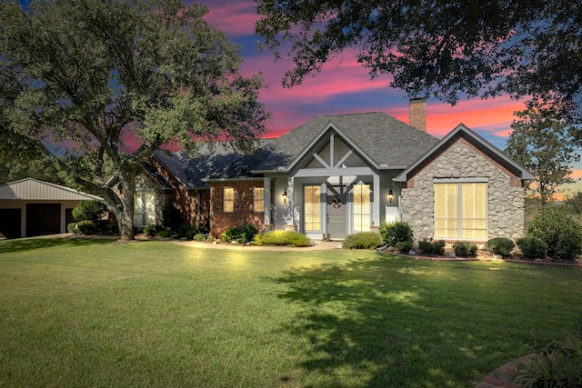 view of front of house with a yard