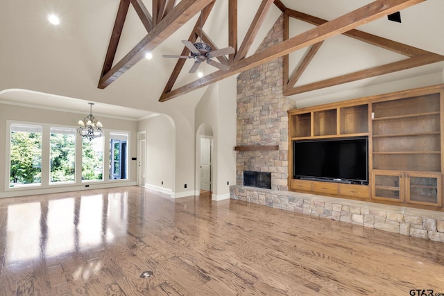 unfurnished living room featuring high vaulted ceiling, hardwood / wood-style floors, and beamed ceiling