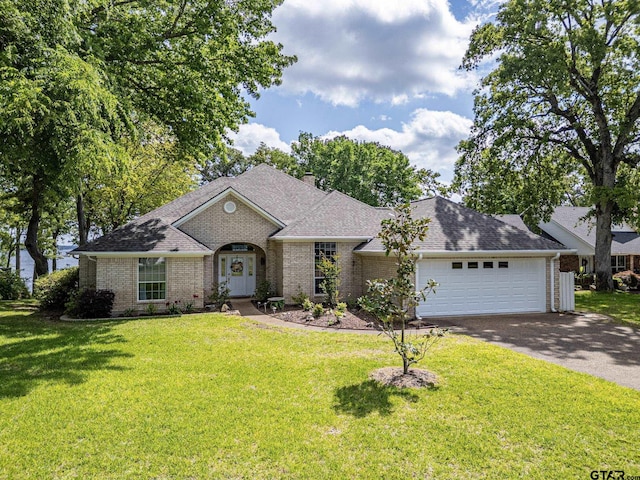 22770 Diamond Bay Dr, Frankston, TX 75763 - french country home with brick siding, driveway, a garage, and a front yard
