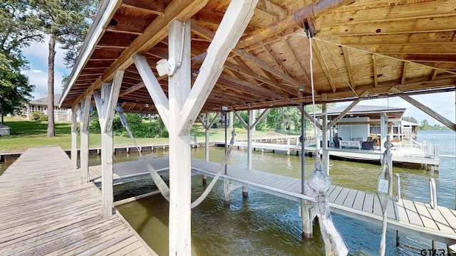 view of dock with a water view and boat lift