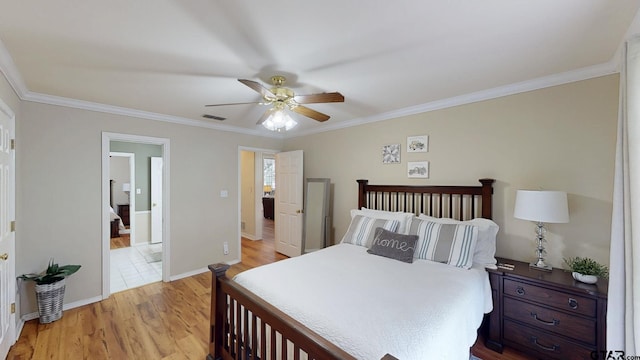 bedroom featuring baseboards, visible vents, light wood-style floors, ceiling fan, and crown molding