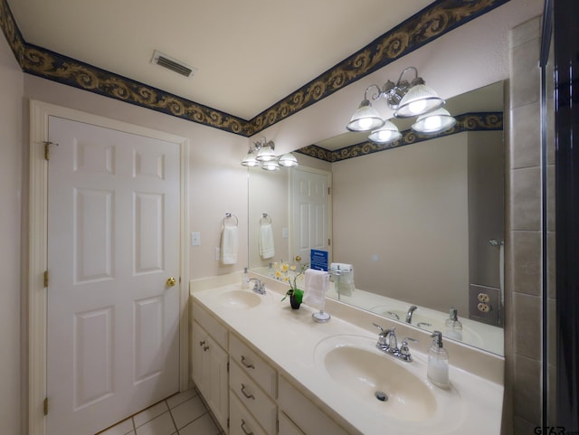 full bath with tile patterned flooring, a sink, visible vents, and double vanity