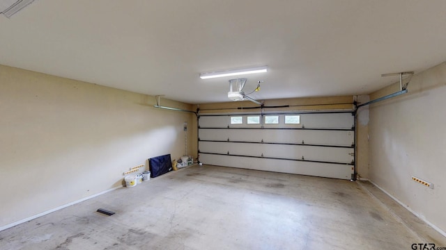 garage featuring a garage door opener