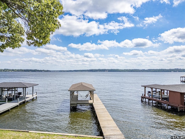 view of dock featuring a water view and boat lift