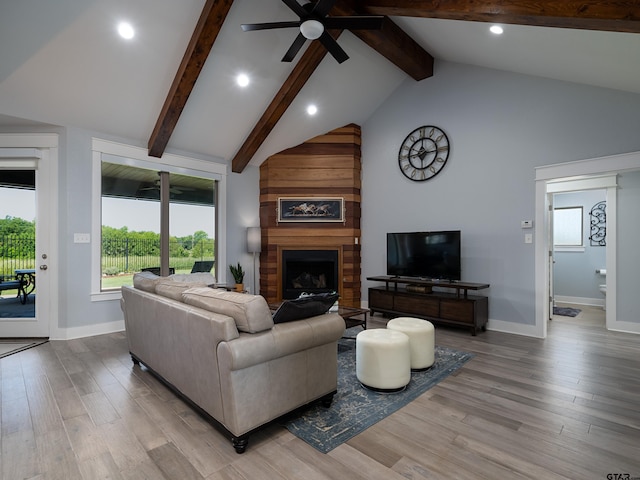 217 Providence Pl, Bullard, TX 75757 - living room with beamed ceiling, ceiling fan, light wood-style flooring, a fireplace, and recessed lighting