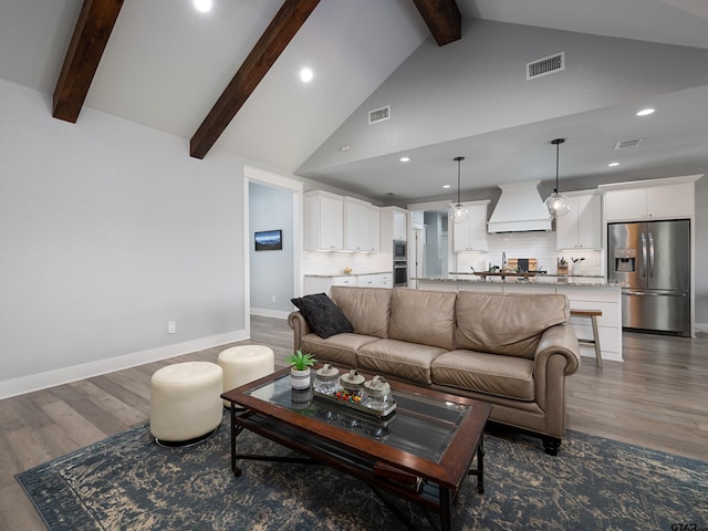 217 Providence Pl, Bullard, TX 75757 - living area with wood finished floors, recessed lighting, beam ceiling, and high vaulted ceiling