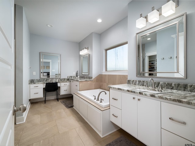 217 Providence Pl, Bullard, TX 75757 - bathroom with two vanities, a bath, and recessed lighting