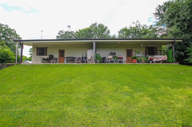 308 N Kay St, Winona, TX 75792 - back of house featuring a yard and a patio