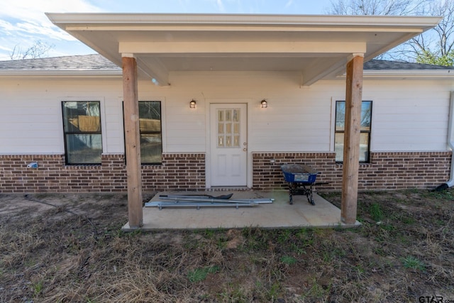 entrance to property with a patio