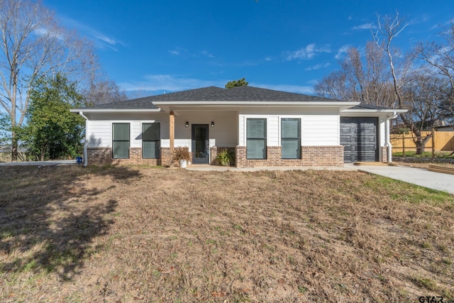 view of front of house with a garage and a front yard