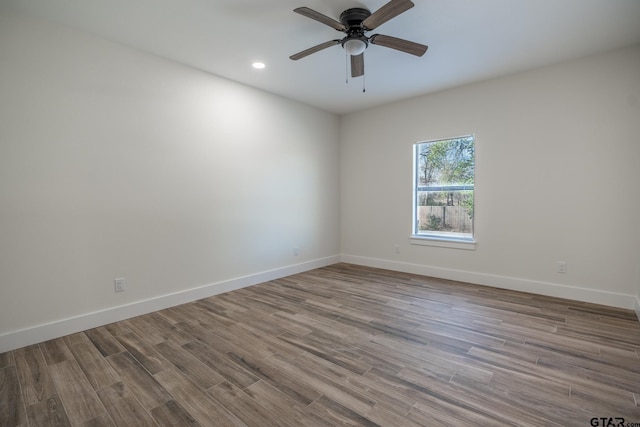 unfurnished room featuring light hardwood / wood-style floors and ceiling fan