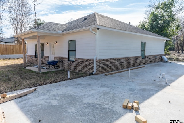 view of side of property featuring a patio