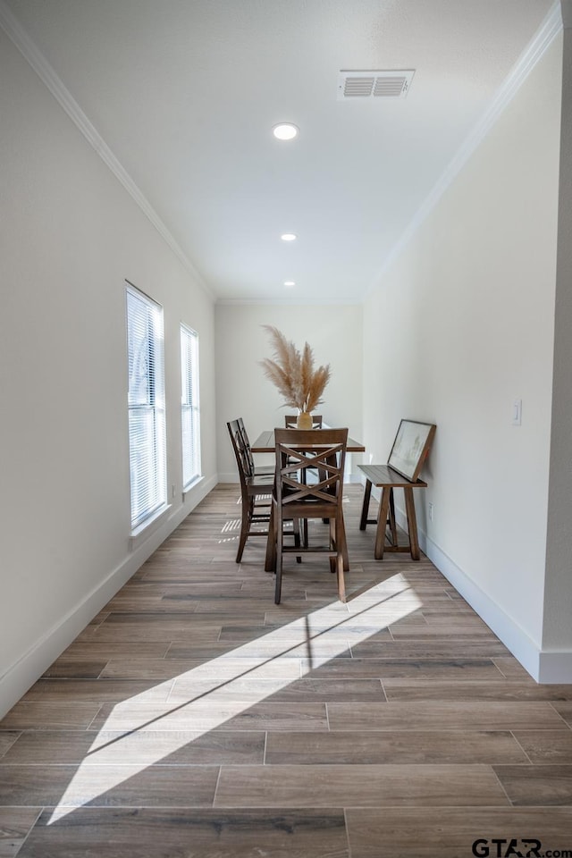 dining area featuring ornamental molding