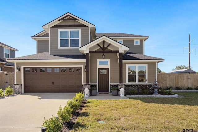 view of front of home featuring a garage and a front yard