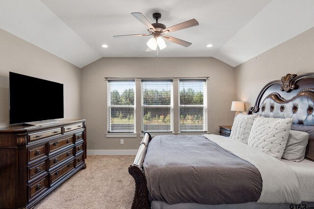 bedroom featuring light carpet, ceiling fan, and lofted ceiling