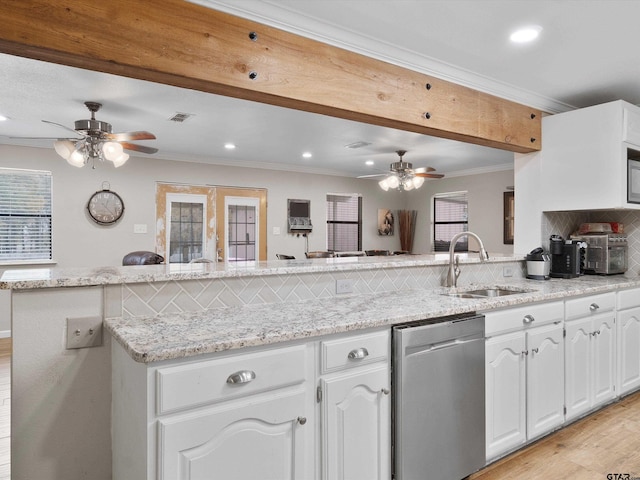 kitchen with tasteful backsplash, stainless steel dishwasher, ornamental molding, sink, and white cabinetry