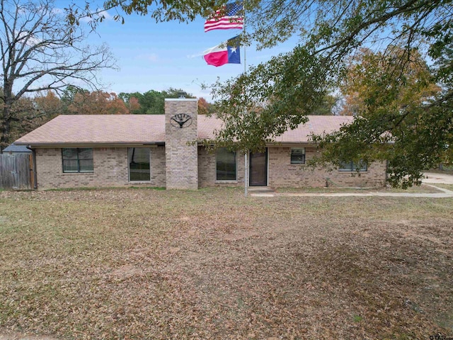 ranch-style house with a front lawn