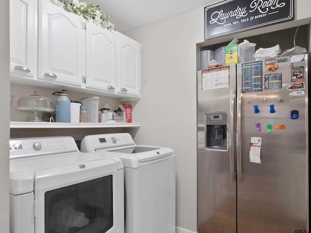 laundry area with cabinets and separate washer and dryer