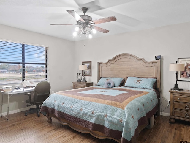 bedroom with hardwood / wood-style flooring and ceiling fan