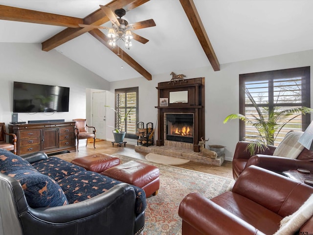 living room featuring hardwood / wood-style floors, vaulted ceiling with beams, and ceiling fan