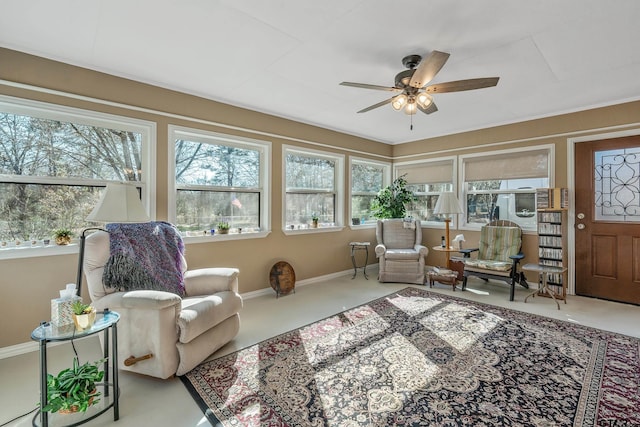 sunroom featuring ceiling fan