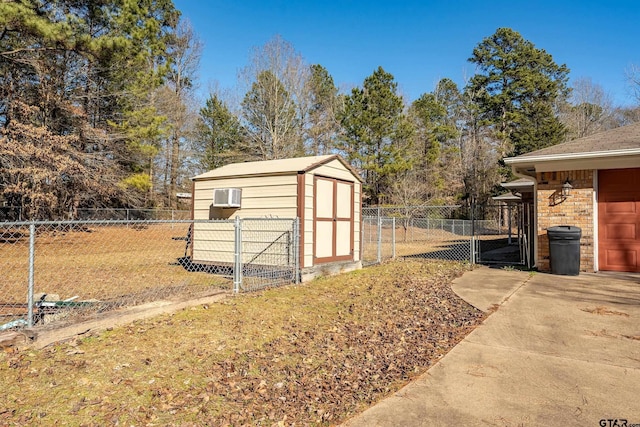 view of outbuilding with a lawn and a wall mounted AC