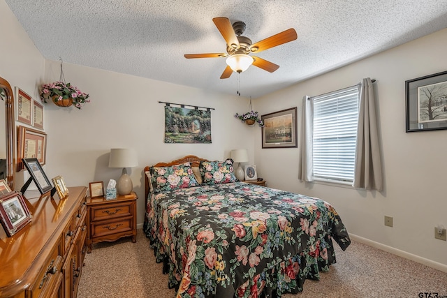 bedroom with light carpet, a textured ceiling, and ceiling fan