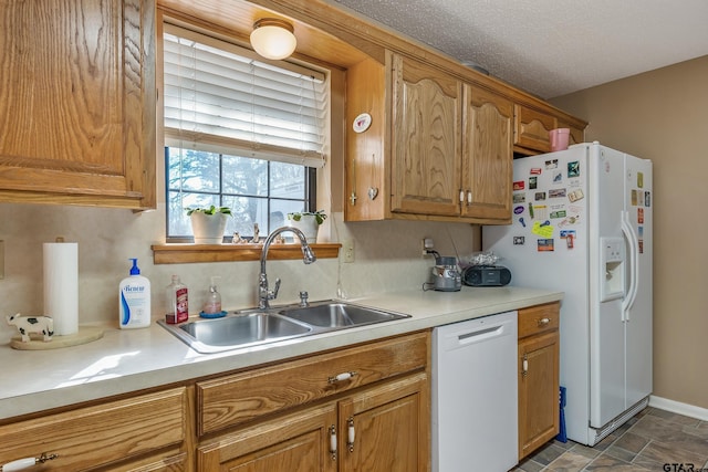 kitchen with sink and white appliances