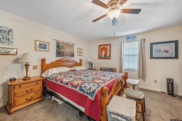 carpeted bedroom with a textured ceiling and ceiling fan