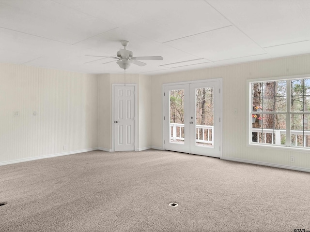 221 Butternut Gln, Holly Lake Ranch, TX 75765 - carpeted spare room with a ceiling fan and french doors