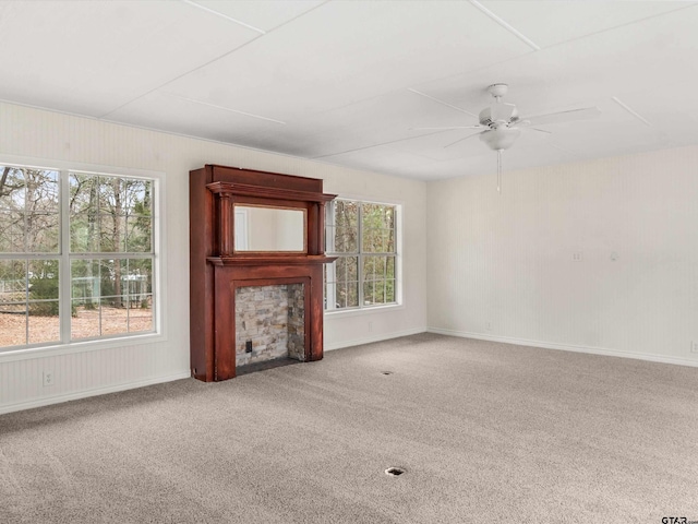 221 Butternut Gln, Holly Lake Ranch, TX 75765 - unfurnished living room featuring ceiling fan, a fireplace, and carpet