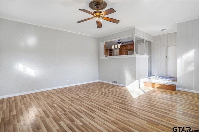 unfurnished room featuring ceiling fan, ornamental molding, and light hardwood / wood-style floors