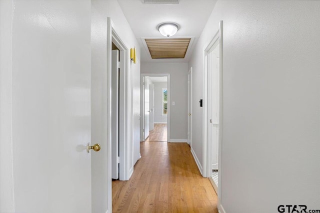 hallway with light wood-type flooring