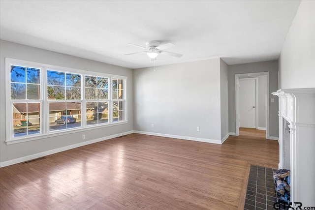 spare room featuring ceiling fan and hardwood / wood-style floors