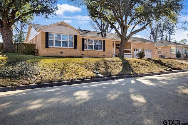 ranch-style house featuring a garage