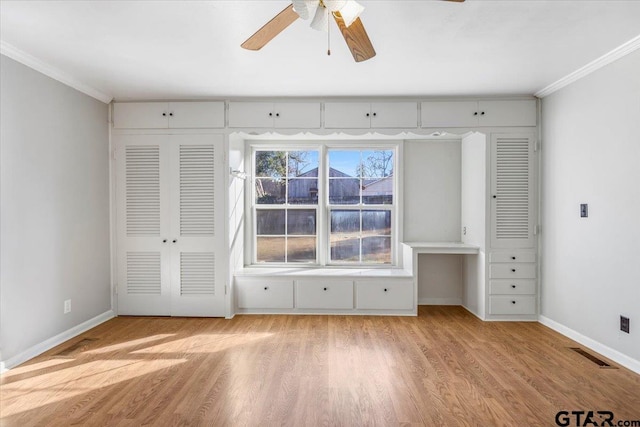 unfurnished bedroom featuring crown molding, ceiling fan, and light hardwood / wood-style flooring